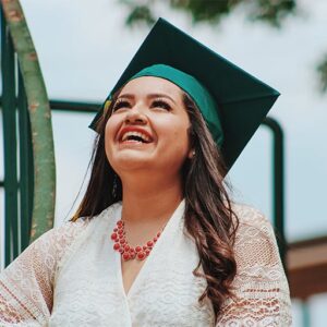 Woman in graduation cap.