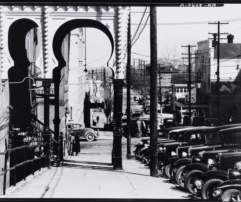 Tower Loan History 1 Black and white photo of sidewalk and cars